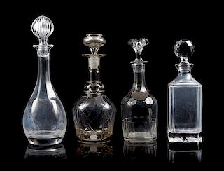 Four Glass Decanters Height of tallest 13 1/2 inches.