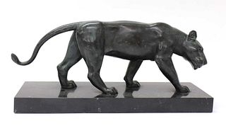A bronze of a prowling lioness