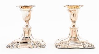 A Pair of Silver-plate Candlesticks Height 4 1/2 inches.