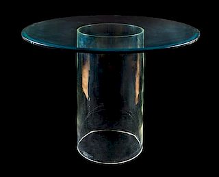 * A Contemporary Glass Occasional Table Height of first 28 3/4 x width 54 x depth 24 inches.Estimate $ 200-400Height 29 x diameter of top 42 inches.Pr