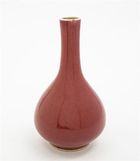 * A Sang de Boeuf Glazed Bottle Vase Height 8 inches.