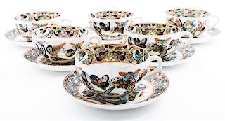 * A Set of Six Chinese "Hundred Butterflies" Porcelain Cups and Saucers Diameter of saucers 5 3/8 inches.