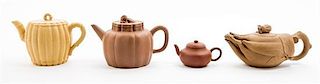 * Four Yixing Pottery Teapots Width of widest 7 inches.