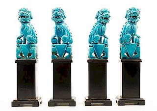 * Four Chinese Turquoise Glazed Porcelain Figures of Fu Lions. Height of each 6 inches.