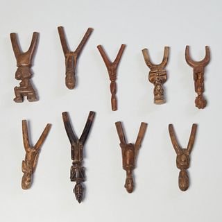 Group (9) African carved wood slingshots