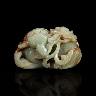 A Chinese greyish-celadon and russet jade recumbent beast and lotus group 青玉雕瑞兽衔荷花 18th century or earlier 十八世纪或更早