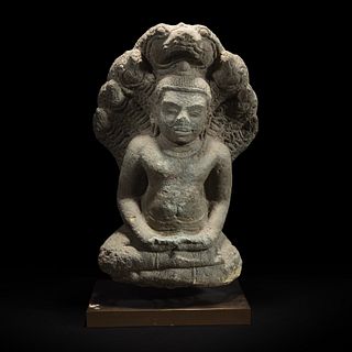 A Khmer style carved stone figure of Buddha seated under a cobra canopy 高棉风格石雕眼镜蛇冠冕佛首