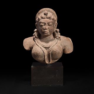 An Indian carved stone bust of a female deity 印度石雕女性神像 12th Century or earlier 十二世纪或更早