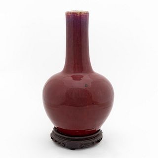 CHINESE SANG DE BOEUF BOTTLE VASE ON WOODEN STAND