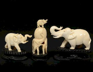 GROUP OF THREE CARVED IVORY FIGURES OF ELEPHANTS