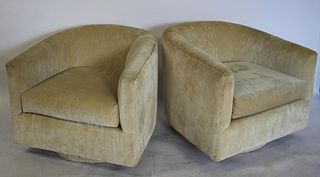 A Midcentury Pair Of Upholstered Swivel Chairs.