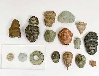 GROUP OF SIXTEEN ASSORTED MASKS AND AMULETTES
