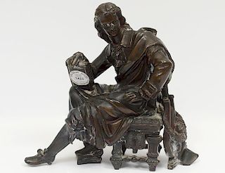 PATINATED WHITE METAL FIGURE OF A SEATED POET