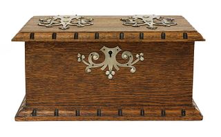 An Arts and Crafts oak and pewter-mounted casket,