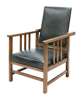 An Arts and Crafts oak reclining armchair,