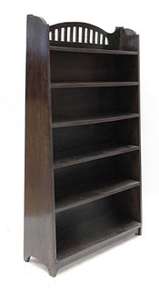 An Arts and Crafts stained oak bookcase,