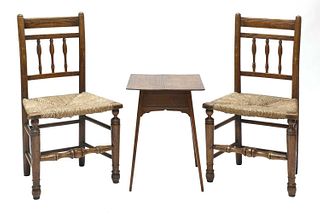 A pair of Arts and Crafts oak side chairs,