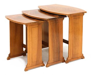 An Art Deco walnut nest of three tables,