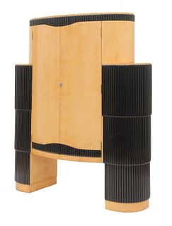An Art Deco maple and ebonised ‘Big Bertha’ cocktail cabinet,