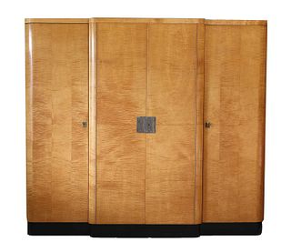 An Art Deco maple and ebonised breakfront wardrobe,