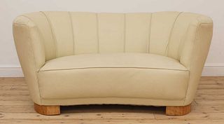 An Art Deco cream leather settee,
