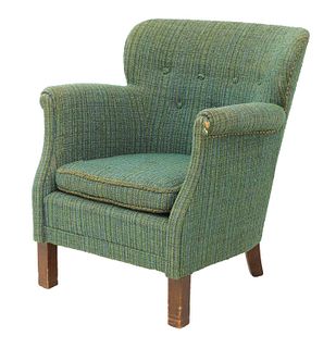 A green and blue upholstered armchair,