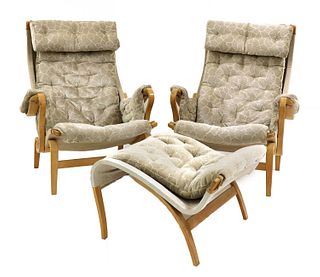 A pair of 'Pernilla 69' lounge chairs and an ottoman,