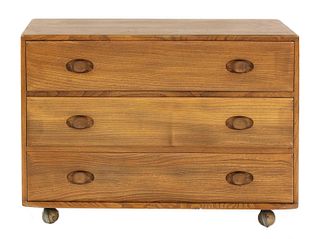 An Ercol elm chest of drawers,