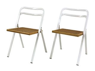A pair of folding chairs,