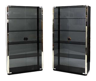 A pair of smoked glass and chrome display cabinets,