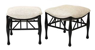 A pair of ebonised Thebes-style stools,
