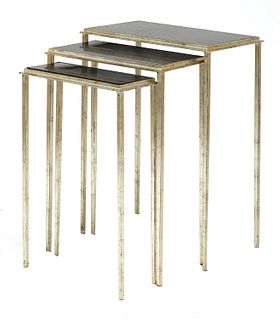 A contemporary nest of three cast aluminium tables,