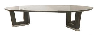 A contemporary ebonised ash extending dining table,