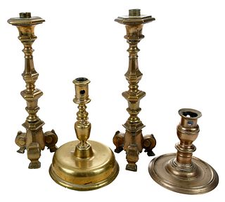 Four Continental Brass Candlesticks