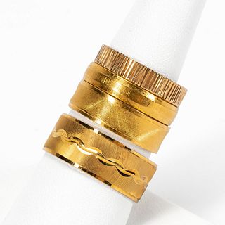 FOUR YELLOW GOLD BANDS, THREE 18K & ONE 14K