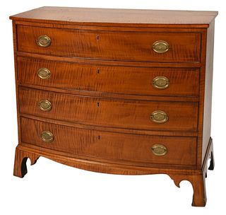 Federal Tiger Maple Bowed Front Chest
having four drawers set on bracket base
circa 1800
height 34 inches, width 38 inches, top 18 1/2 x 39 inches