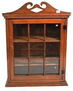 Primitive Cabinet 
having broken arch top over one door with recessed panel side
height 36 1/2 inches, top 27 3/4 inches