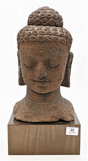 Large Carved Sandstone Head of a Buddha
sitting on pedestal base
height 18 1/2 inches