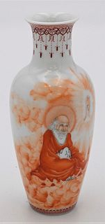 Small Chinese Porcelain Vase
having painted scholar figure and flaming clouds
signed on side
height 5 1/2 inches