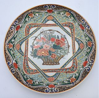 Large Chinese Famille Verte Porcelain Charger
having painted and enameled flowers in a basket, center with scrolling vines and flowers around exterior