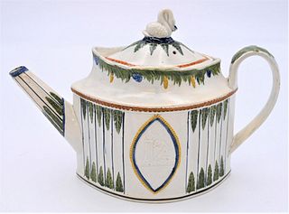 Prattware Leeds Teapot
decorated pearlwork with four colors, swan finial and raised scene on each side
height 7 1/2 inches
Provenance: Estate of James