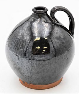 Redware Small Jug having handle and dark brown glaze small chip on foot height 6 1/4 inches