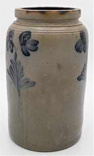 Two Gallon Stoneware Crock
having double blue flower on three sides
height 13 1/2 inches
Provenance: Estate of Bruce Sasalla, East Hartford, Connectic