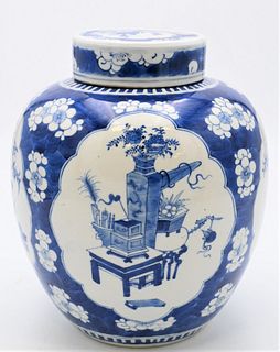 Chinese Porcelain Blue and White Jar with Cover
panels painted with antiques, blossoming tree with bird
four character mark on bottom
Qing Dynasty
18t