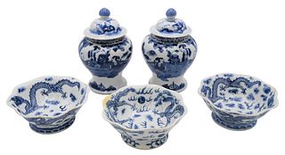 Five Piece Chinese Blue and White Porcelain Group
to include a pair of covered jars having painted figures in courtyard scene (chipped)
along with thr