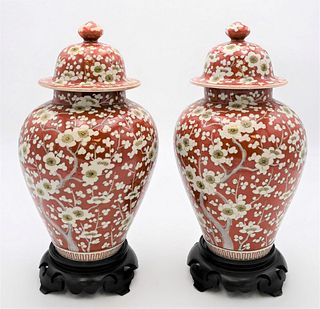 Pair of Chinese Apple Blossom Covered Jars
having enameled red and white blossoming flowers
height 13 1/2 inches
Provenance: From a private New York C