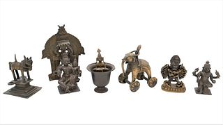 Seven Piece Bronze Lotto include miniature sculptures of Hindu deitiesincluding Vishnu, Durga, Ganesha, and elephant in an arch along with several o