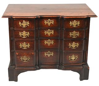 Diminutive Chippendale Mahogany Chest having shaped top over conforming block front of four graduated drawers set on cutout bracket feet with original