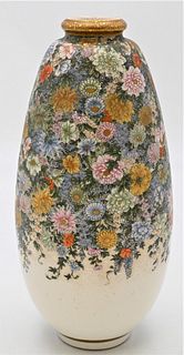 Japanese Satsuma Vase
"Thousand Flowers" millefiori
having gilt rim and intricately floral painted body
black and gold seal mark on bottom
height 12 1