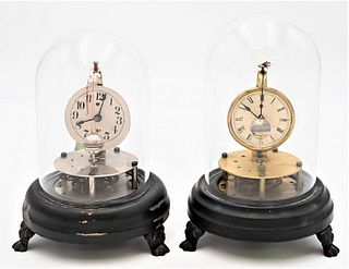 Two Briggs Style Rotary Ball Pendulum Dome Clocks
both having unmarked paper dial on wood base and claw feet
total height 7 1/2 and 8 1/4 inches
Prove